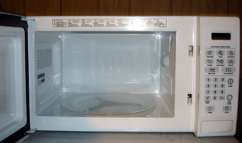 this white microwave is the only thing that could work in a kitchen