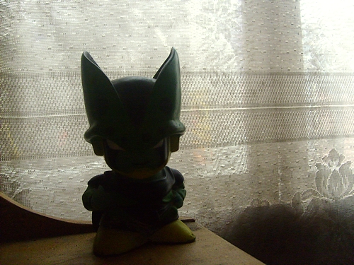 a small bat figurine sitting on top of a table