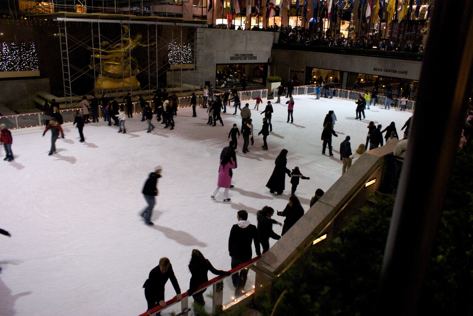 a large skating rink with many skaters skating