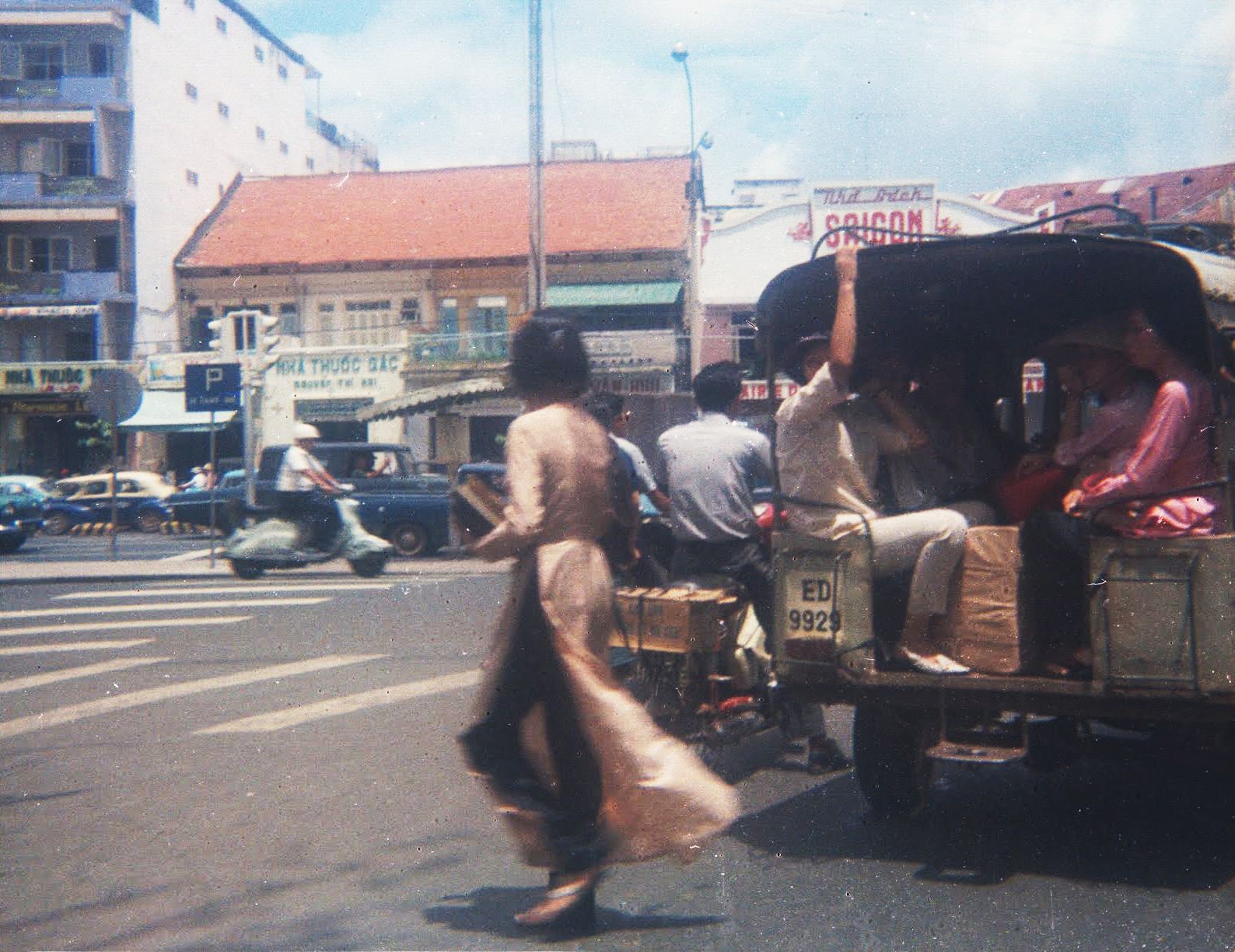 a group of people riding on top of a truck