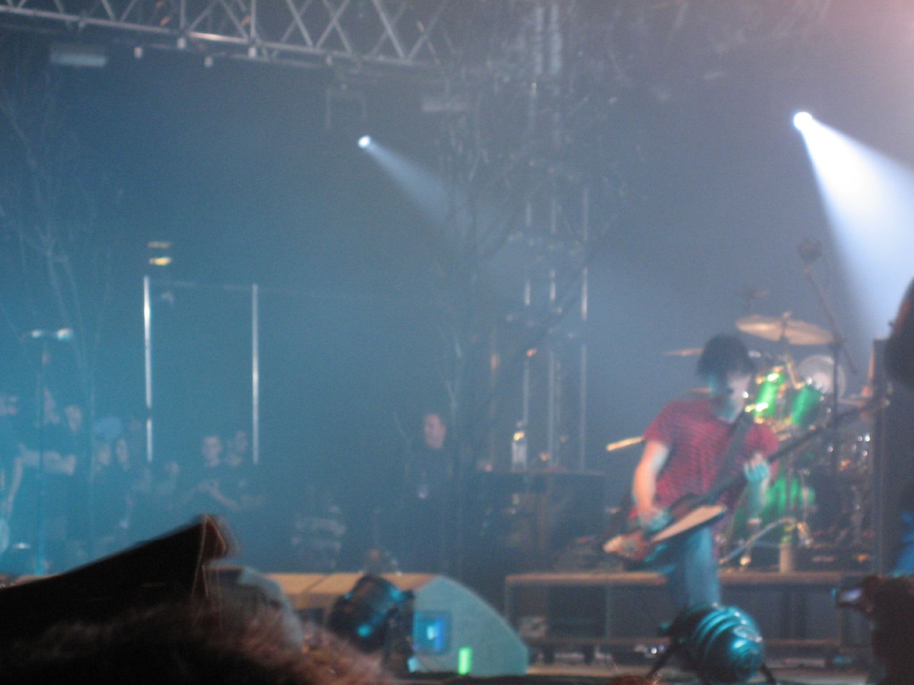 a concert stage filled with lots of blue lights