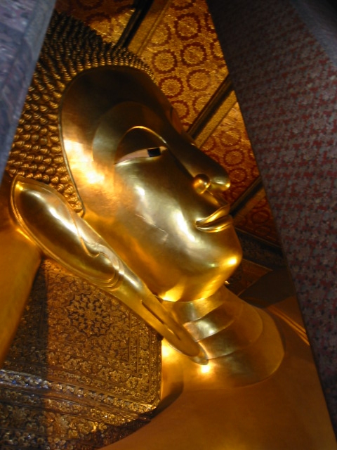 the golden statue is displayed inside the building