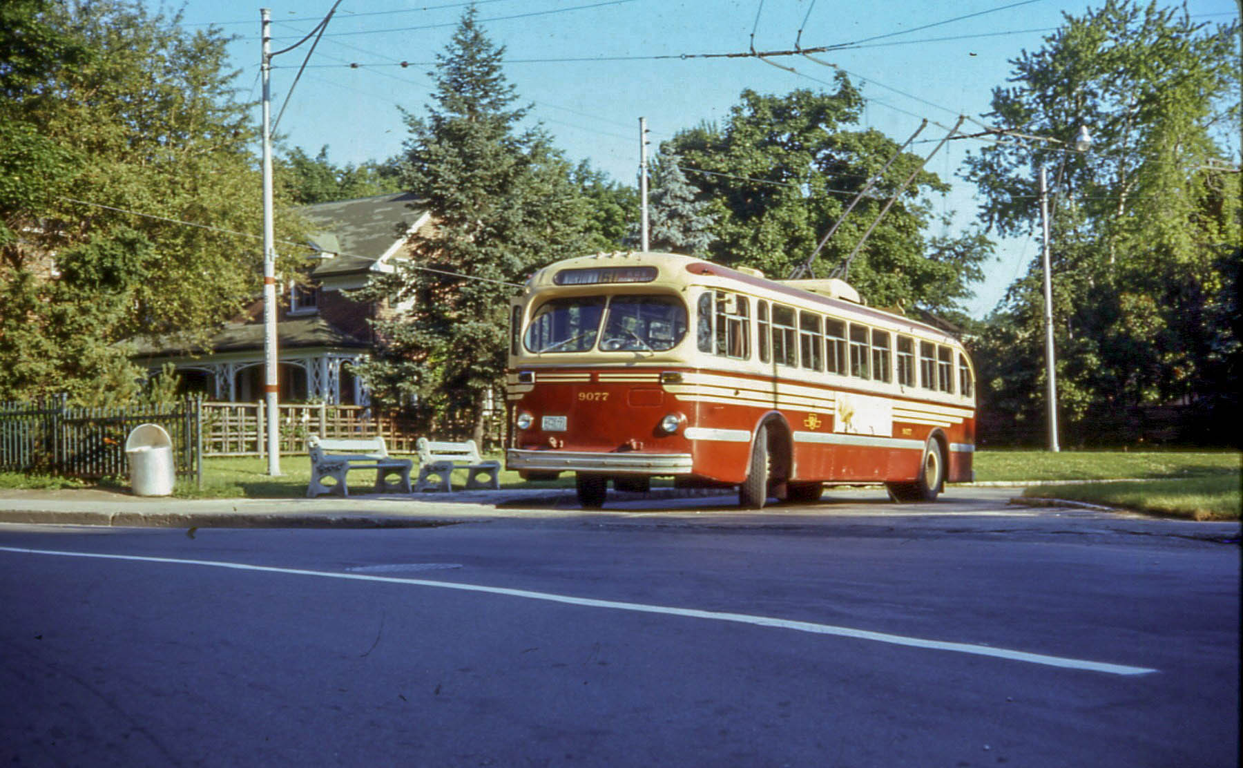 an old bus parked on the side of a street