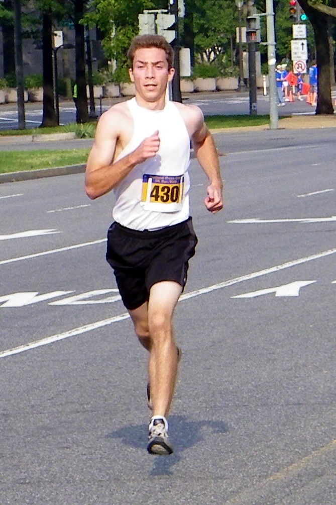 a man running in the street during a marathon