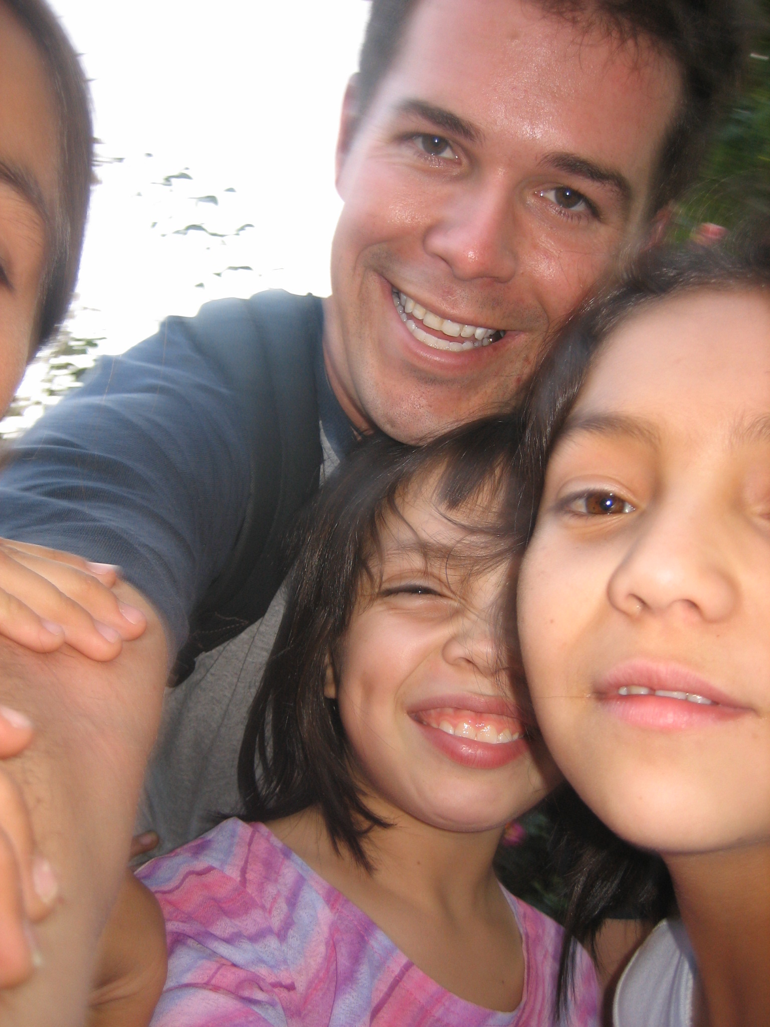 four adults and two children pose for a picture