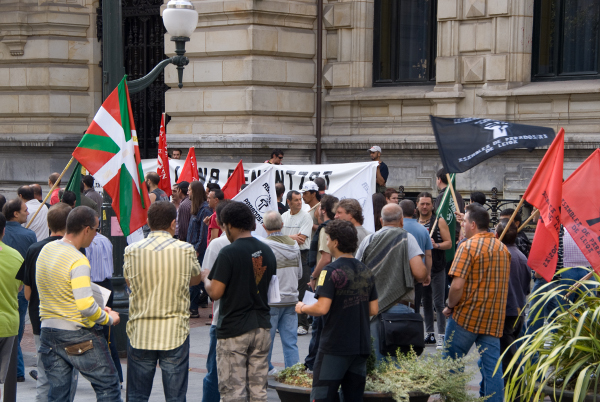 people protesting during the demonstration with flags