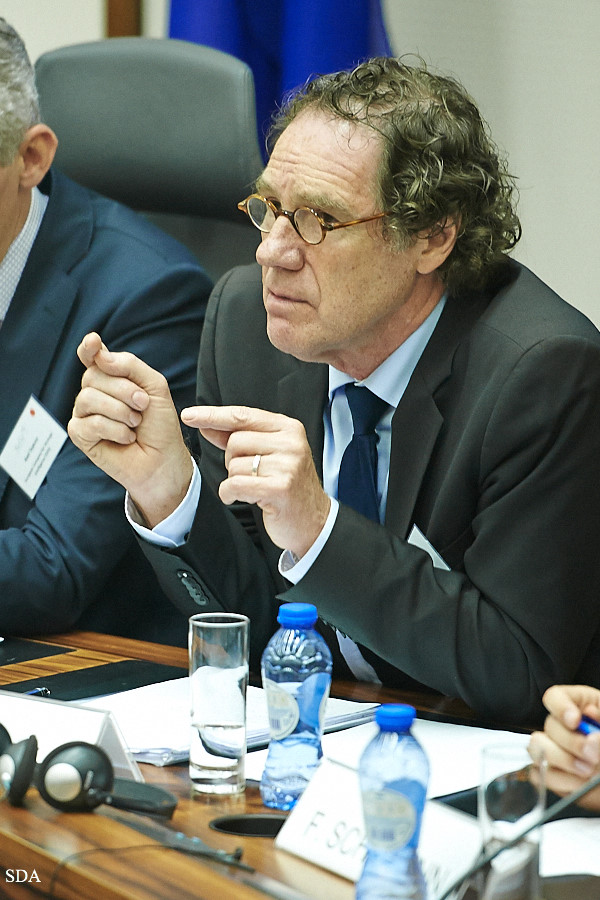 two business men at a meeting in suits and ties