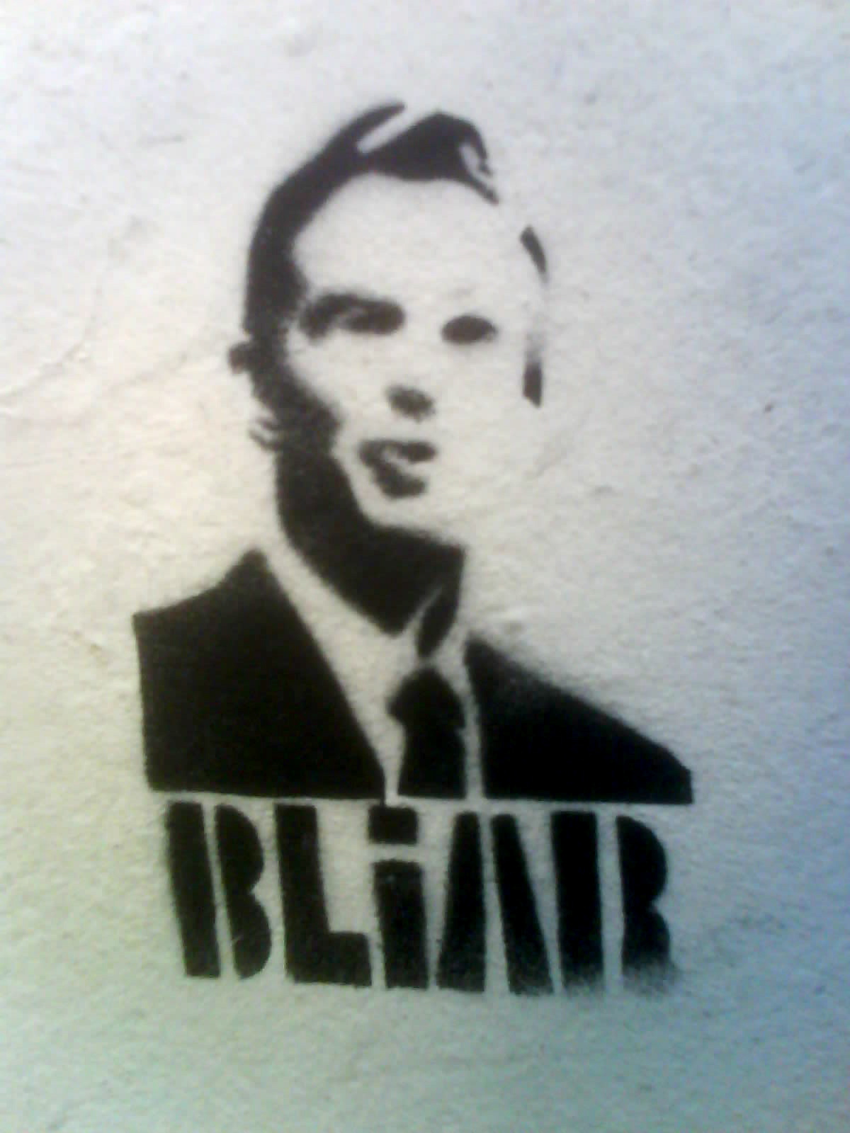 a stencil depicting a man's name on a wall