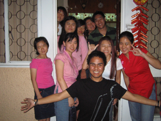 group of people posing for a po at home