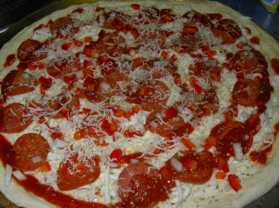 a large pizza is topped with pepperoni and cheese