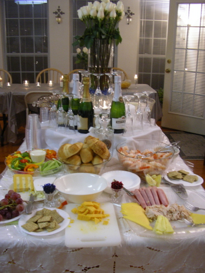 an assortment of food on a table and drinks on the tables