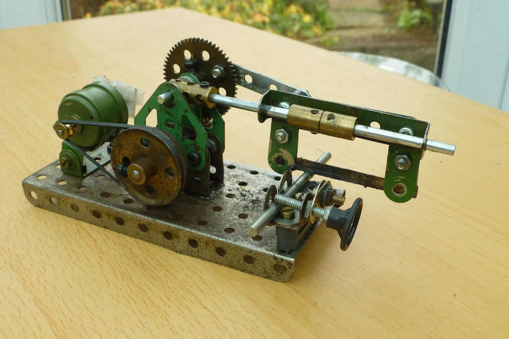 a small piece of machinery sitting on a wooden table