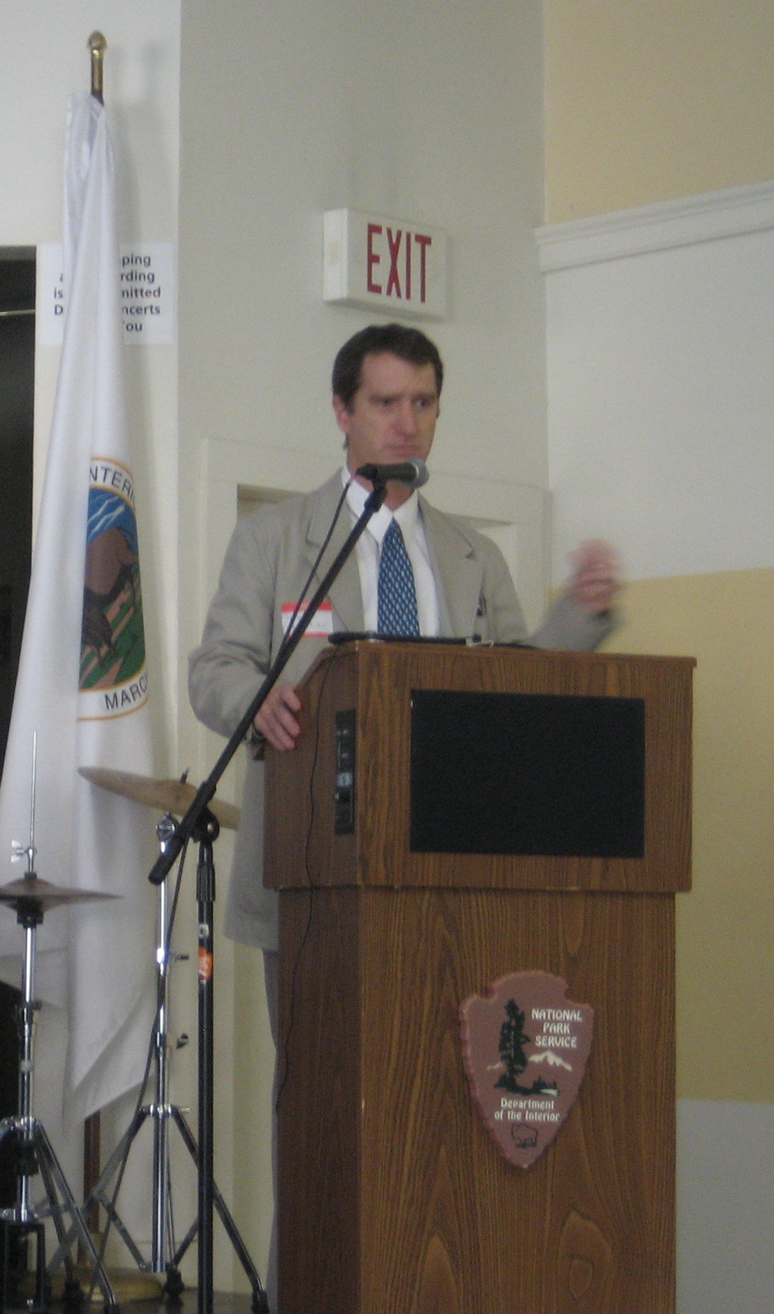 a man standing at a podium giving a speech