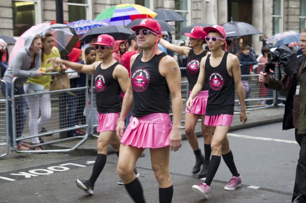 two male roller skate riders in pink skirts and matching shirts