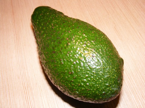 a close up of an avocado on the table