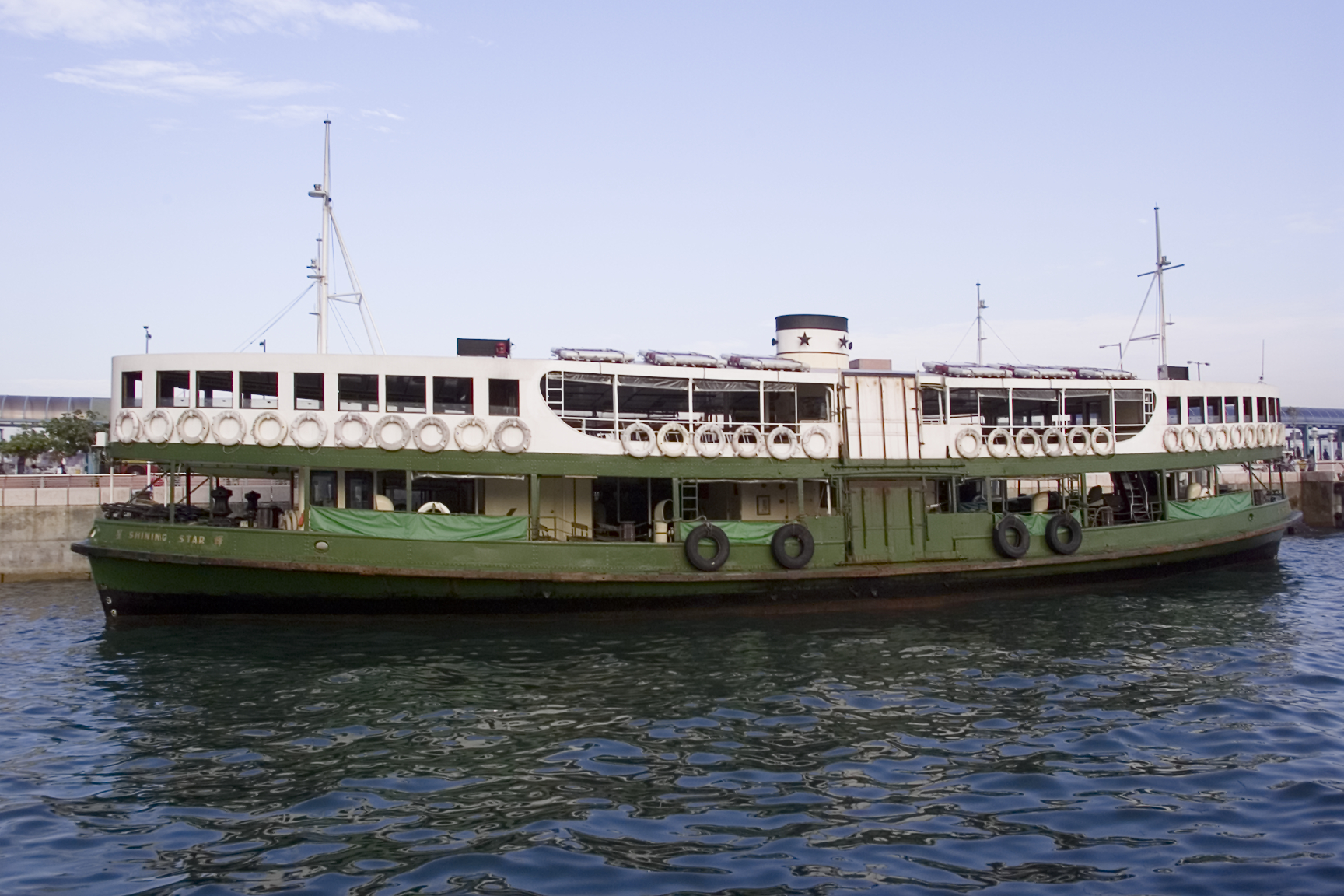 a large ferry is sitting on the water