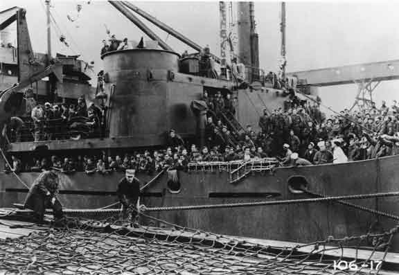 a black and white po of men on a battleship