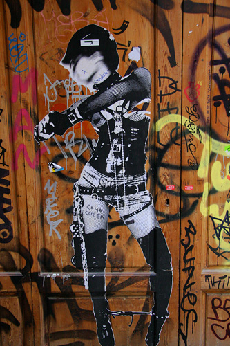 the woman is dressed in black and white graffiti