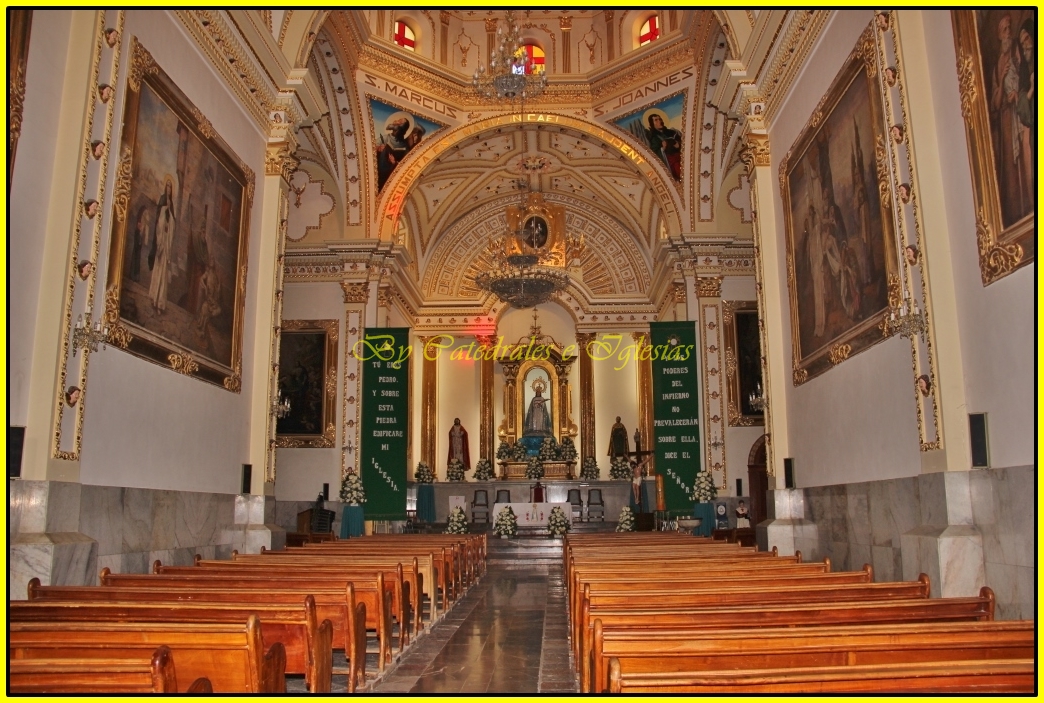 the church has two massive wooden pews in the navel