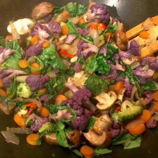 a dish is cooked in a pan with vegetables