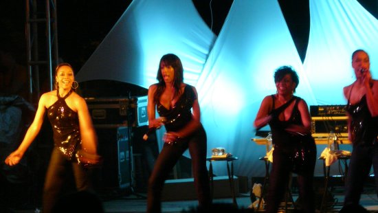 a group of dancers on stage at a concert