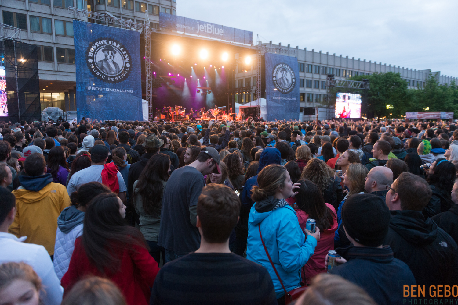 a huge crowd is watching some concert from a stage