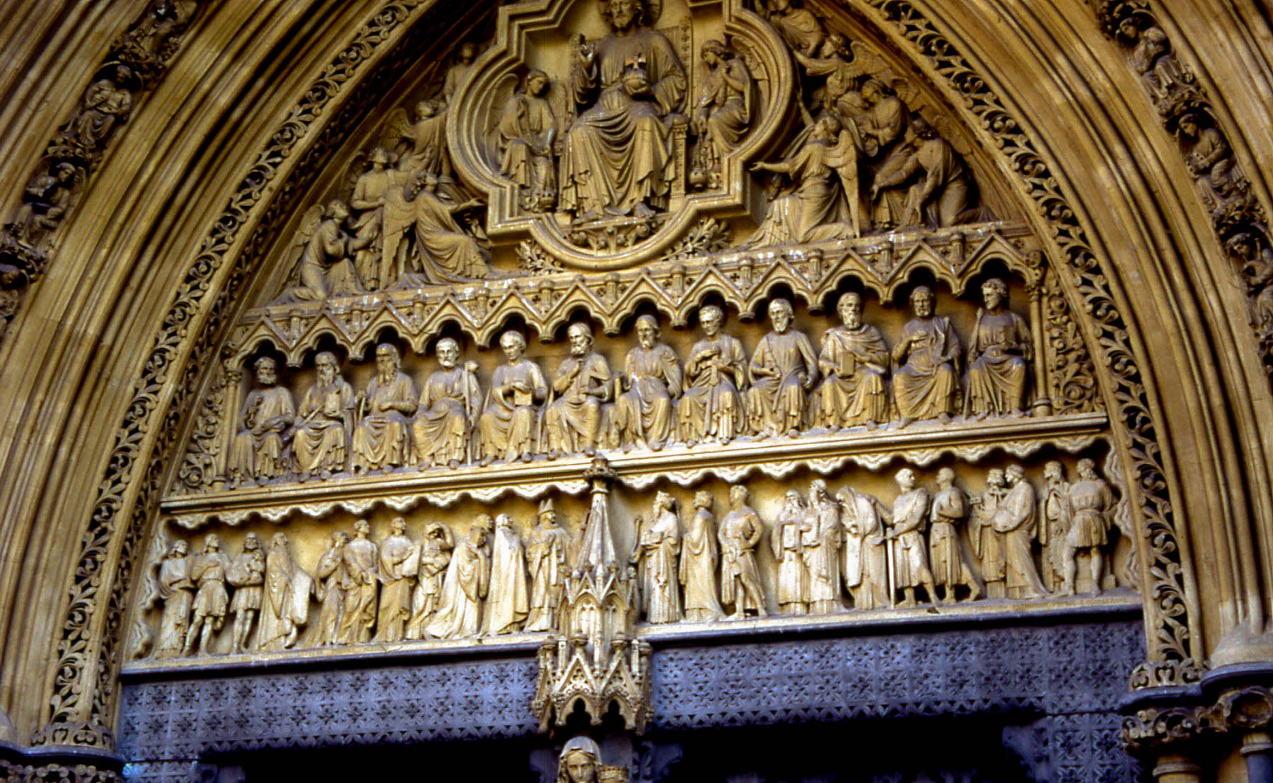a carving of a group of people on display in a building