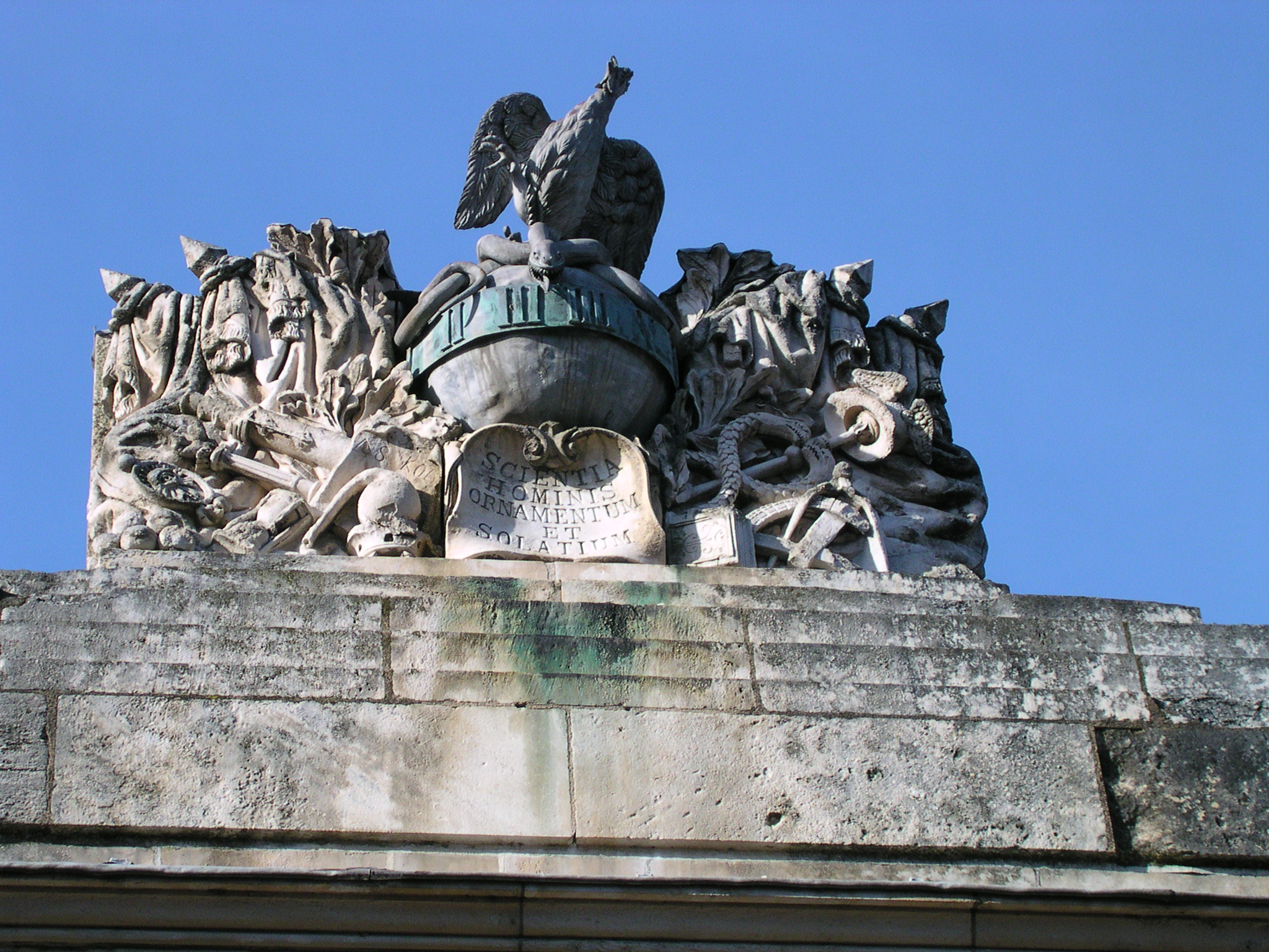 statues and ornaments on the top of a building