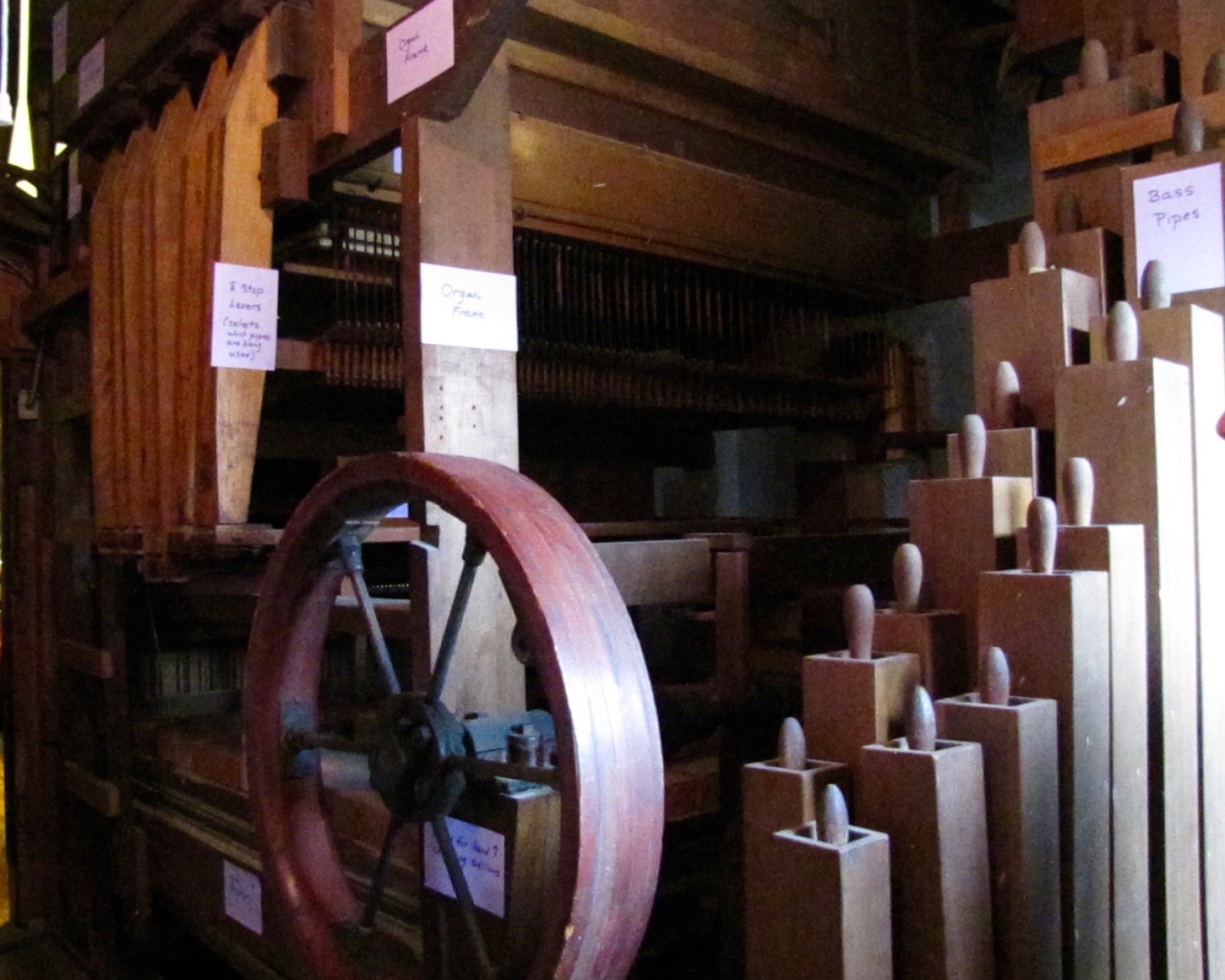 an old spinning wheel is on display in a museum