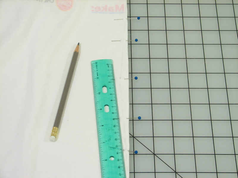 a ruler, a pencil and some other material on a table