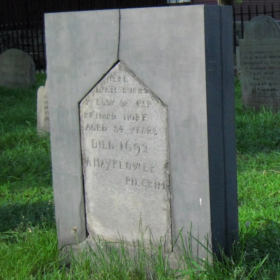 a stone head piece of an old cemetery