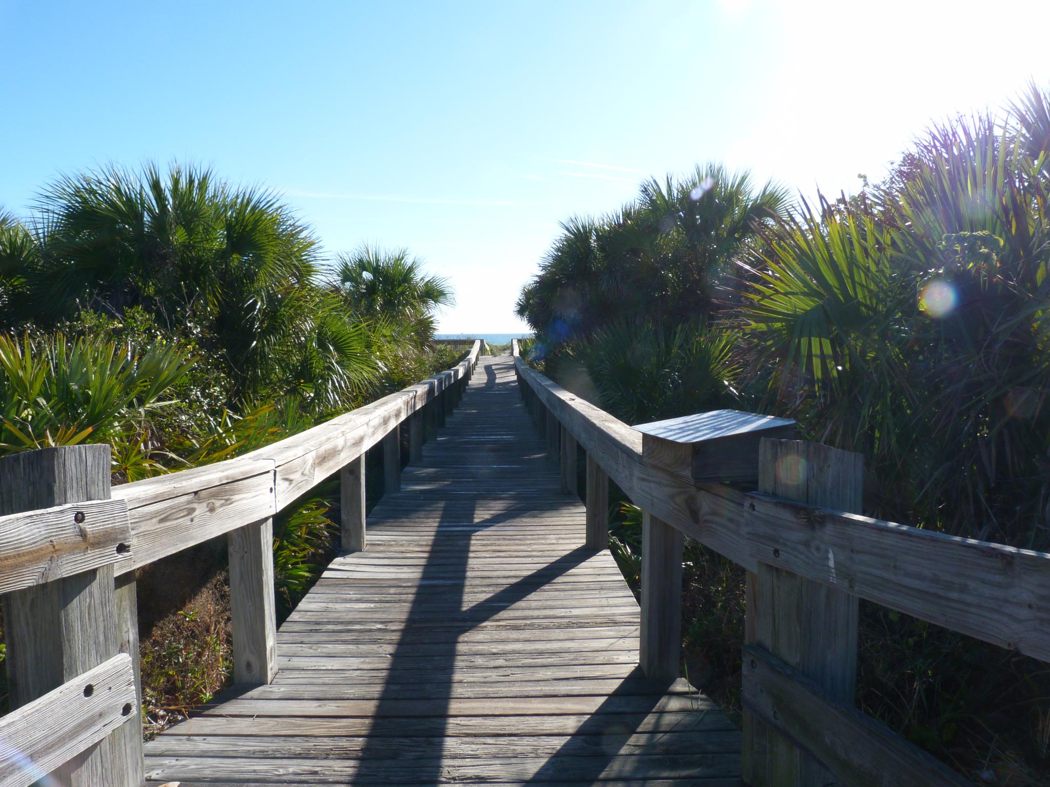 the boardwalk has been made to look like it is going down the beach