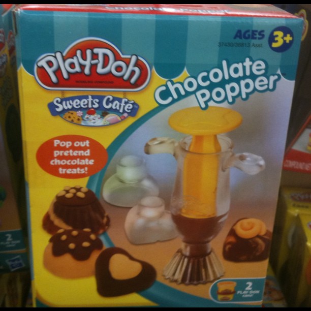 an opened box of play - doh sweets and desserts
