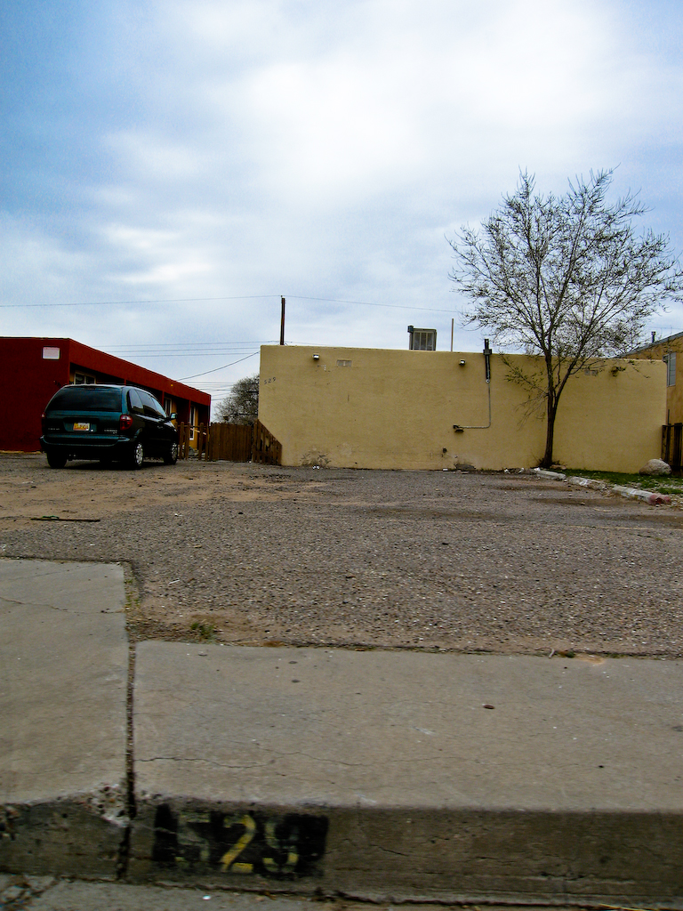 the garage with it's car parked is empty