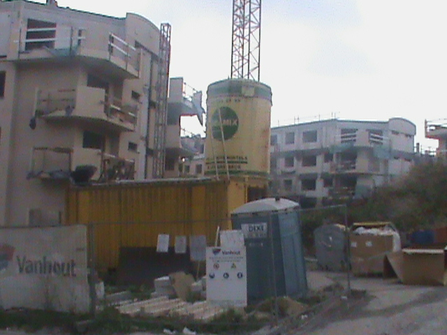 buildings are seen with some water towers in the background