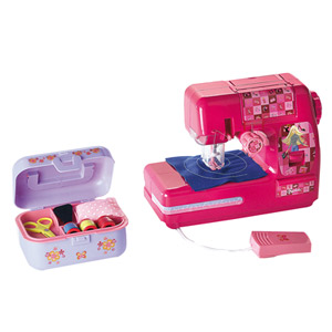 a pink toy sewing machine next to a pink case