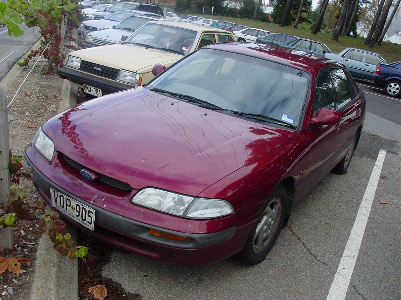 a close up of a parked car in a lot