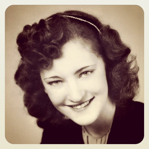 black and white pograph of an older woman smiling
