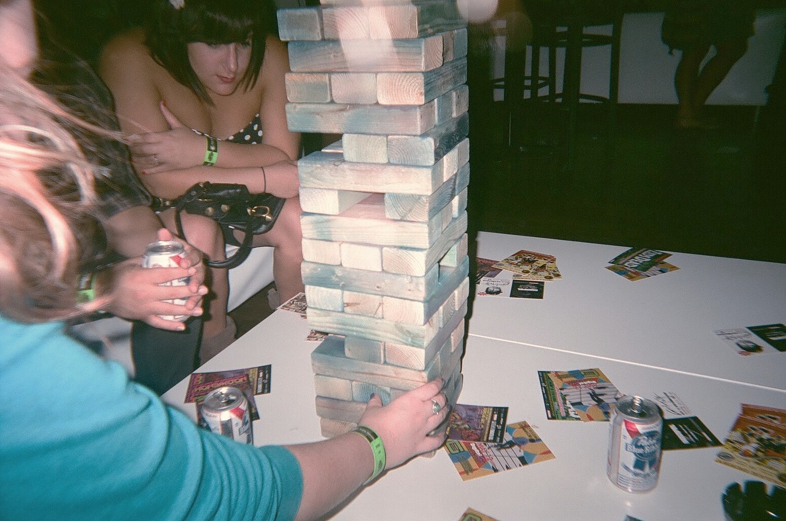 some girls playing a game with cardboard