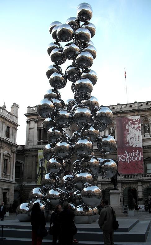 there is a sculpture made of shiny balls