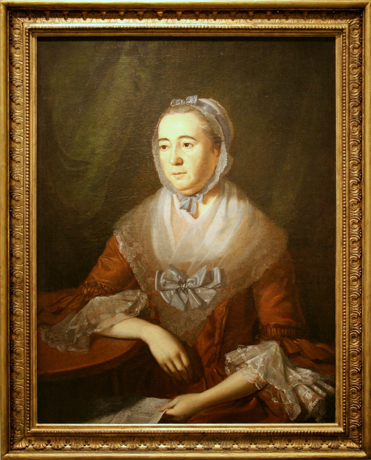 an oil portrait of an old woman with an elegant bow