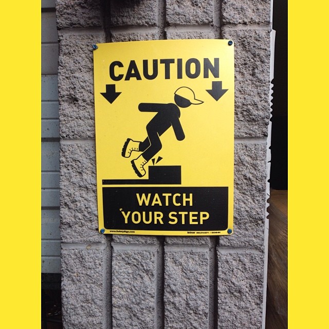 a caution sign on a wall