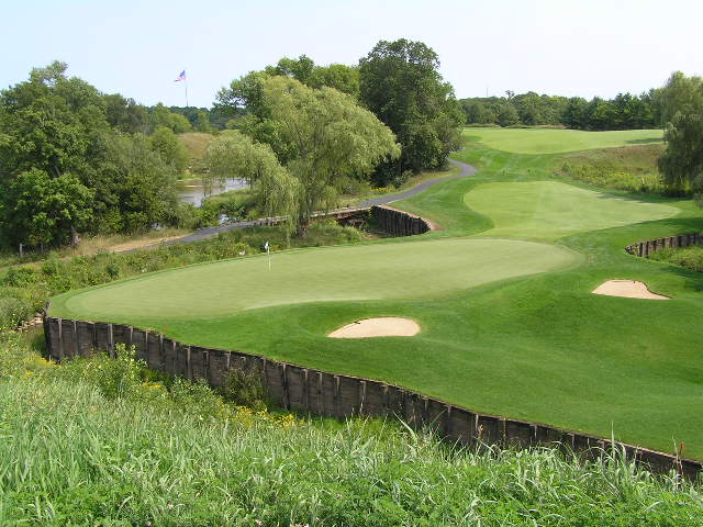 a beautiful golf course with green golf balls on the course