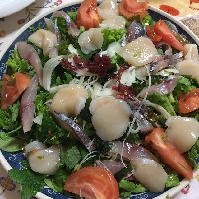 a salad topped with mozzarella in a bowl