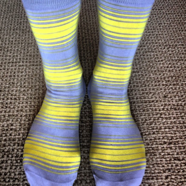 a view of someone's feet with colorful socks