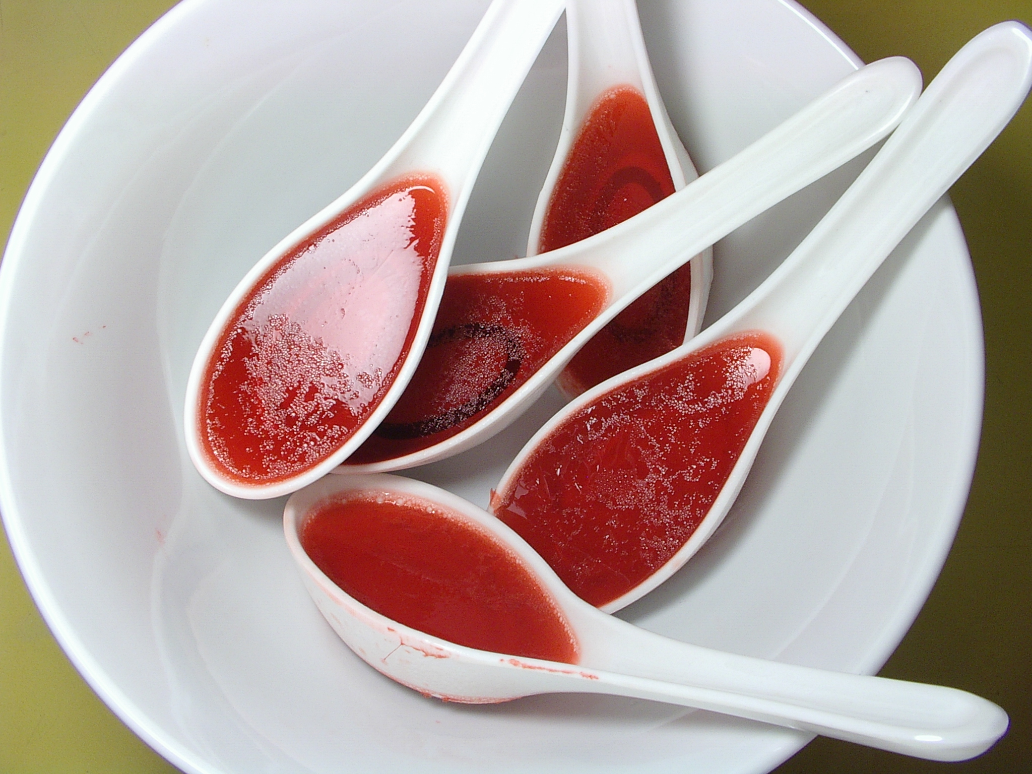 four white scoops with jelly sit on a plate