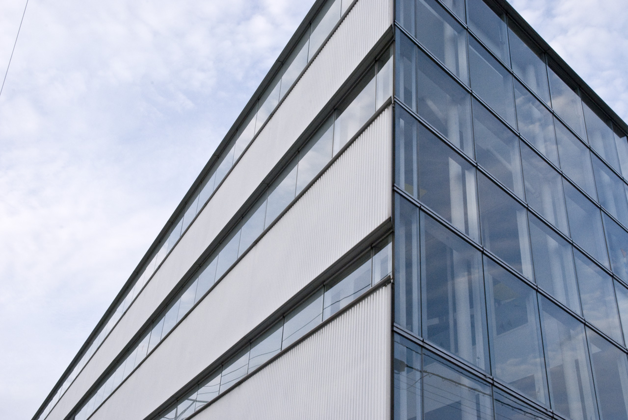 a large gray building with windows that are very tall