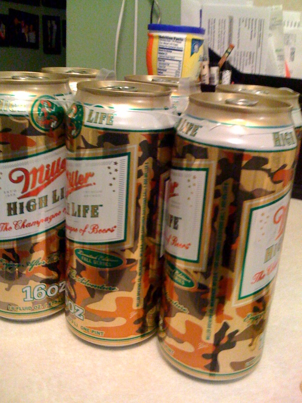 three cans of beer sitting on a counter in an office