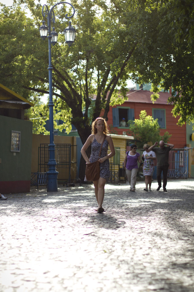a woman is walking in the middle of an area