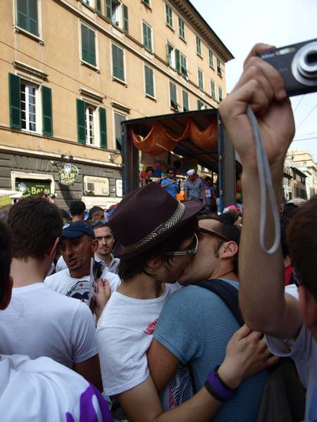 a man taking a picture with his camera at a parade